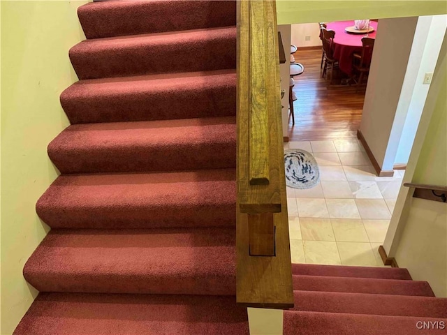 staircase with tile patterned flooring