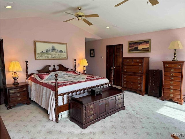 bedroom featuring ceiling fan, light carpet, and vaulted ceiling