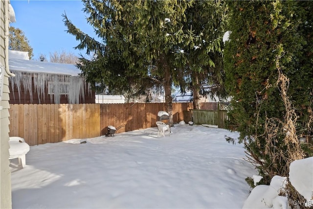 view of yard covered in snow