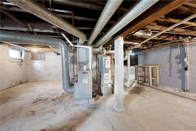 basement featuring gas water heater and heating unit