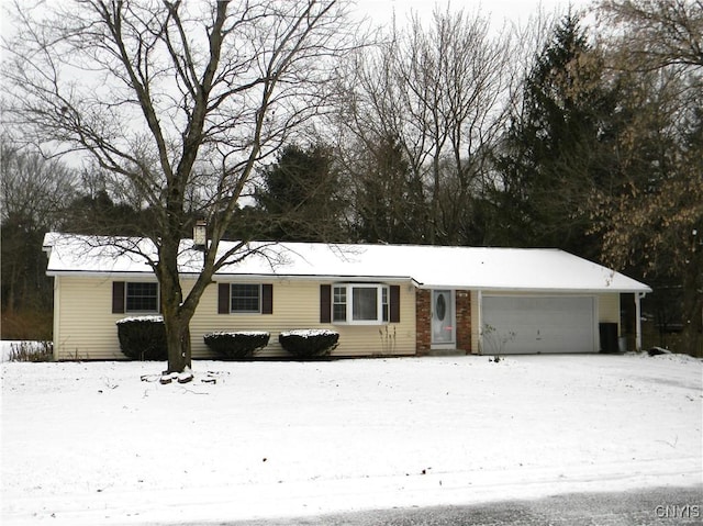 ranch-style home featuring a garage