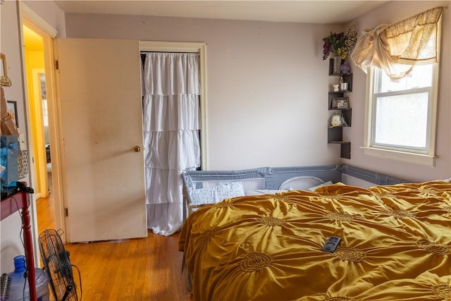 bedroom with light hardwood / wood-style floors