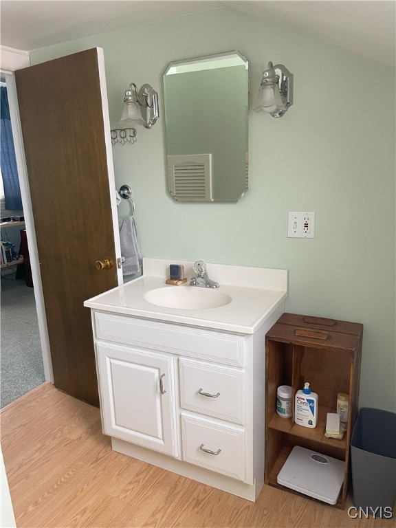 bathroom featuring vanity and hardwood / wood-style floors