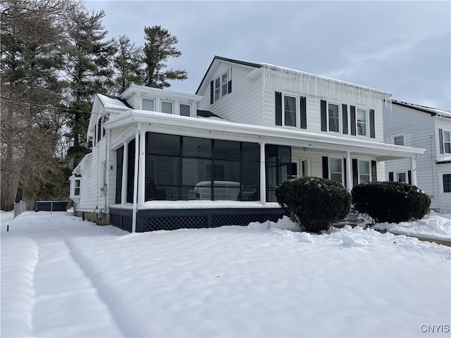 view of front facade with a sunroom