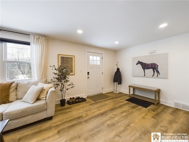 entryway with hardwood / wood-style floors