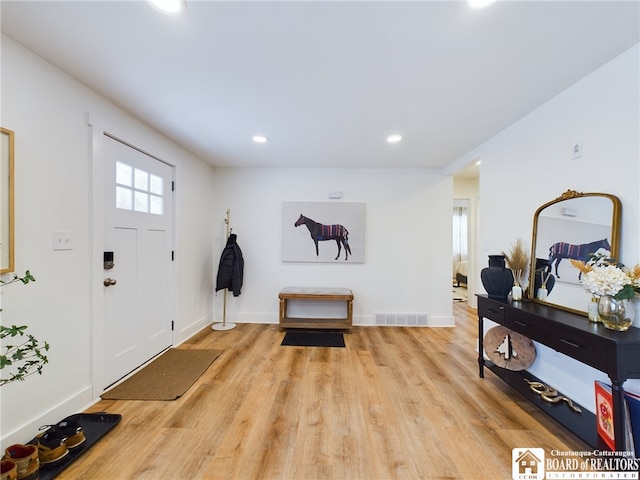 foyer with light wood-type flooring