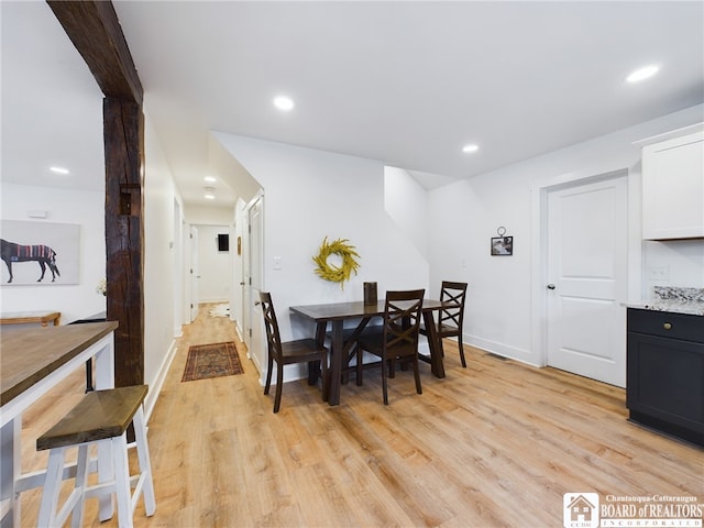 dining area featuring light wood-type flooring