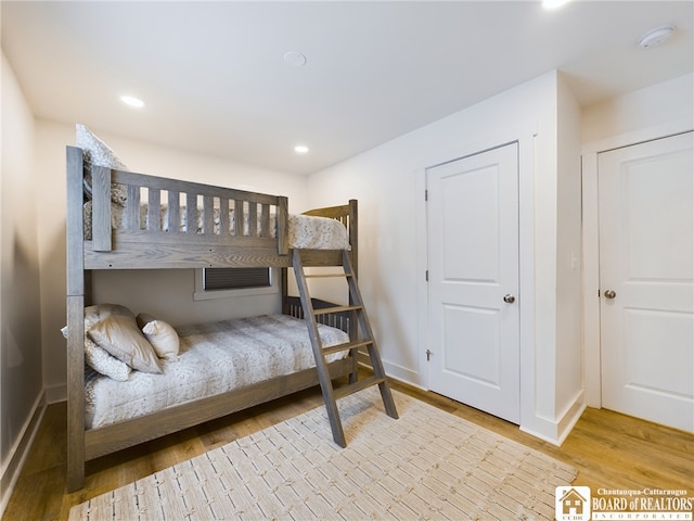 bedroom with light wood-type flooring