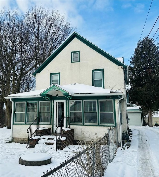 view of front of property featuring an outbuilding and a garage