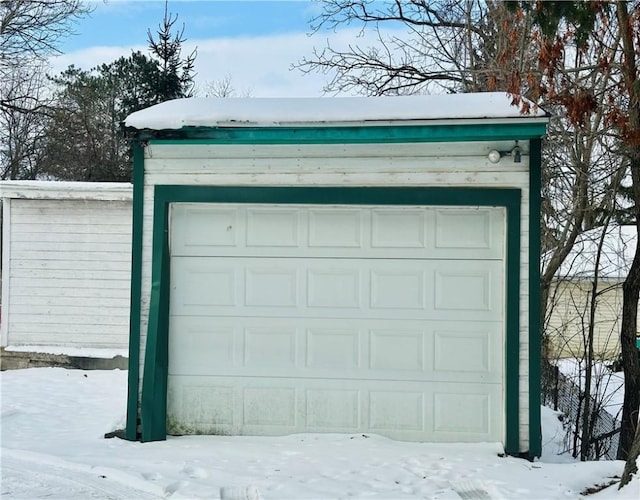 view of snow covered garage