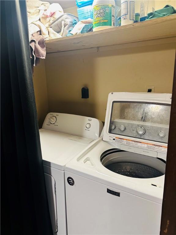 laundry area featuring washing machine and clothes dryer