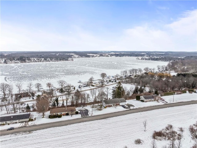 snowy aerial view featuring a rural view