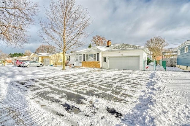 single story home featuring a garage