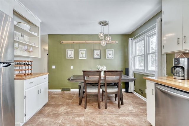 dining area featuring light tile patterned floors