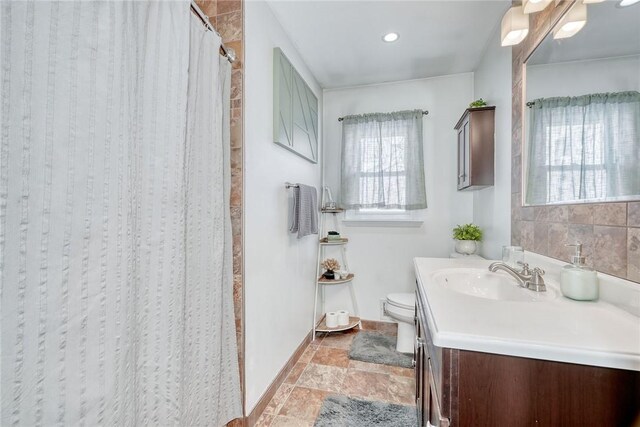 bathroom with vanity and toilet