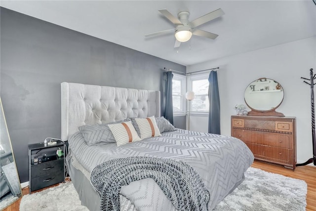 bedroom featuring ceiling fan and hardwood / wood-style floors