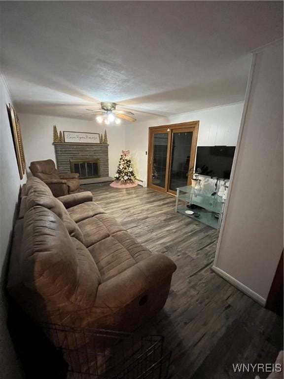 living room with a fireplace, hardwood / wood-style flooring, and ceiling fan