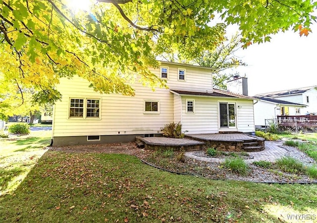 rear view of property with a yard and a patio