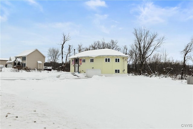 view of snow covered house