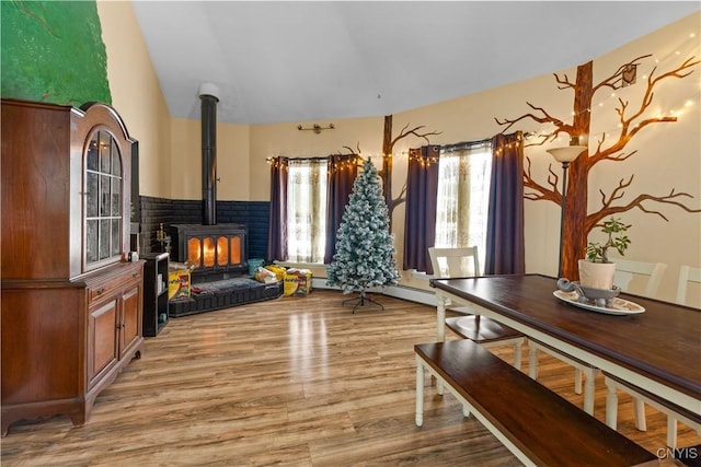 sitting room featuring light hardwood / wood-style floors and a wood stove