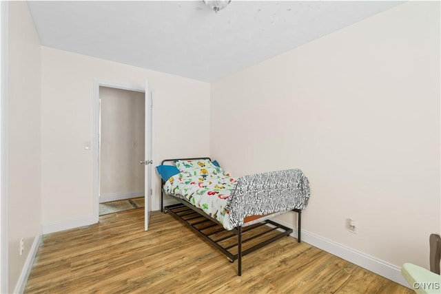 bedroom featuring hardwood / wood-style flooring