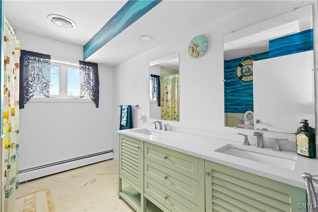 bathroom with baseboard heating and vanity