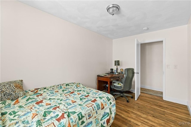 bedroom with hardwood / wood-style floors