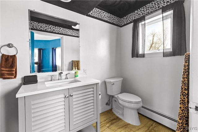 bathroom with vanity, a baseboard radiator, and toilet