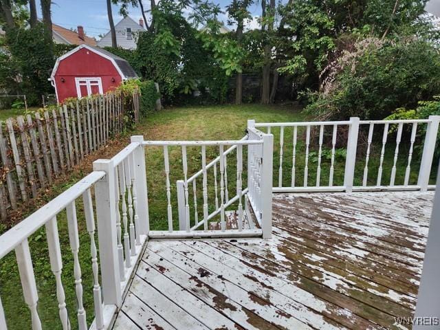 deck with a yard and a storage unit