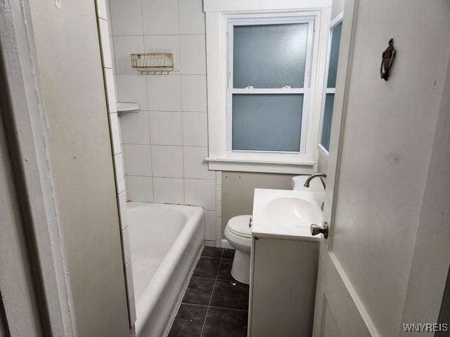 bathroom featuring tile patterned flooring, vanity, and toilet