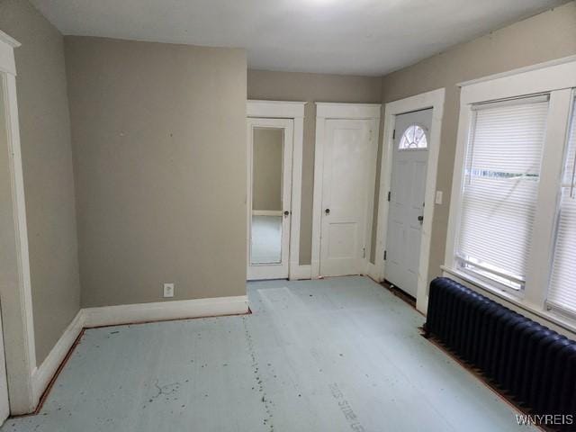 foyer entrance featuring radiator