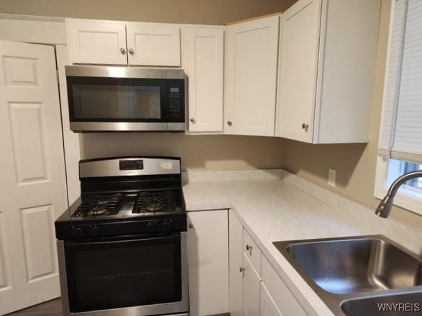 kitchen featuring white cabinetry, sink, and stainless steel appliances