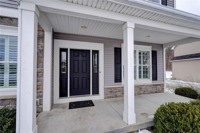 property entrance with covered porch