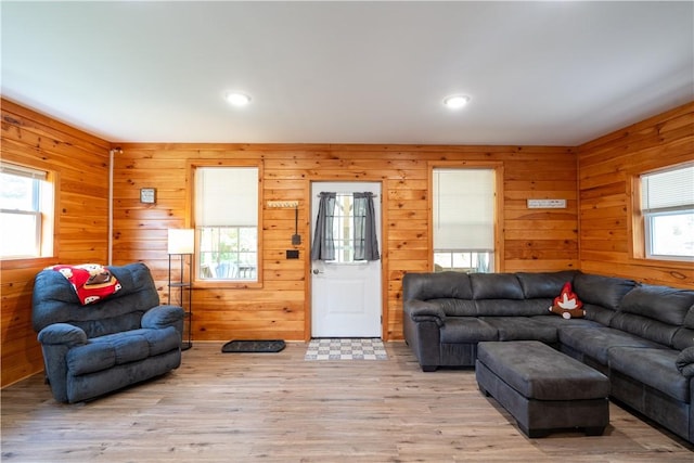 9539 Bronson Rd, Dansville, NY 14572 - living room with light hardwood / wood-style flooring and wooden walls