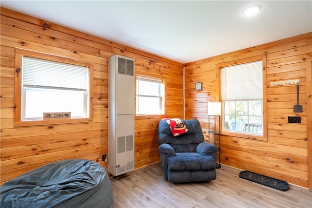 9539 Bronson Rd, Dansville, NY 14572 - bedroom with light hardwood / wood-style floors and wooden walls