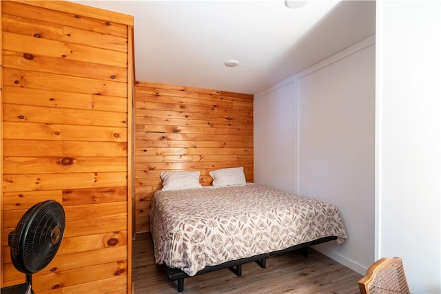 9539 Bronson Rd, Dansville, NY 14572 - bedroom with hardwood / wood-style floors and wooden walls