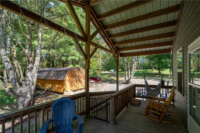 9539 Bronson Rd, Dansville, NY 14572 - wooden terrace featuring a storage unit