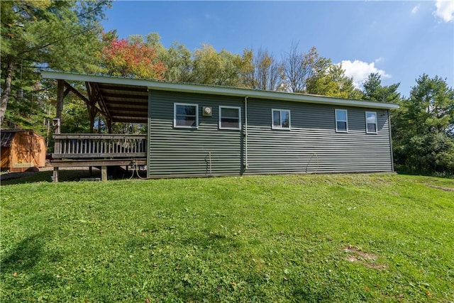 9539 Bronson Rd, Dansville, NY 14572 - view of side of property featuring a yard and a wooden deck