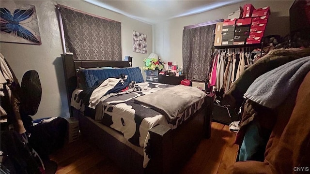 bedroom featuring wood-type flooring