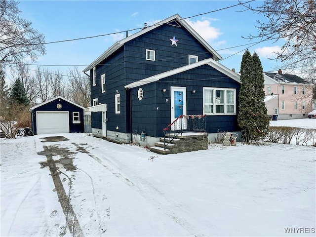 view of front of house featuring a garage and an outdoor structure