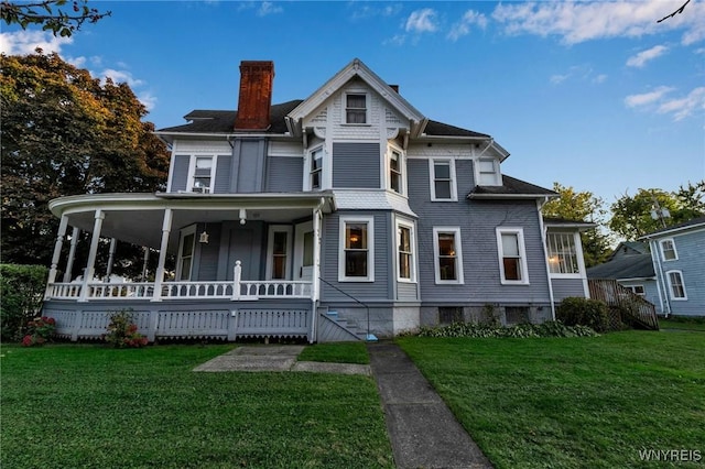 victorian home featuring a front yard and a porch