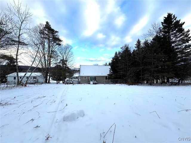 view of yard layered in snow