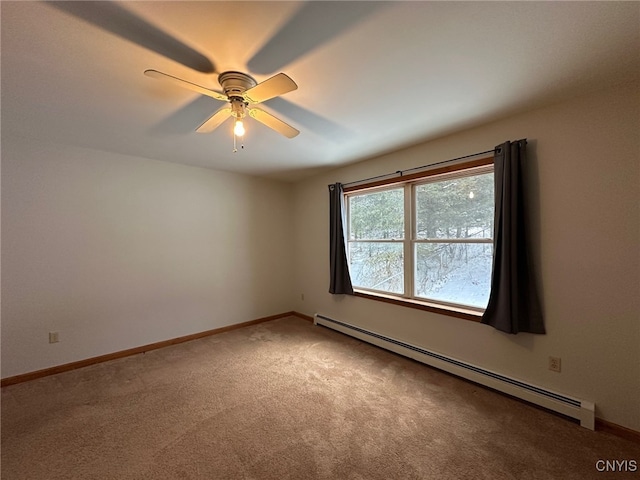 empty room with a baseboard heating unit, ceiling fan, and carpet