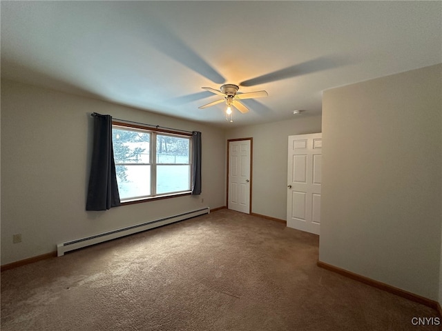 unfurnished room with carpet flooring, baseboard heating, and ceiling fan