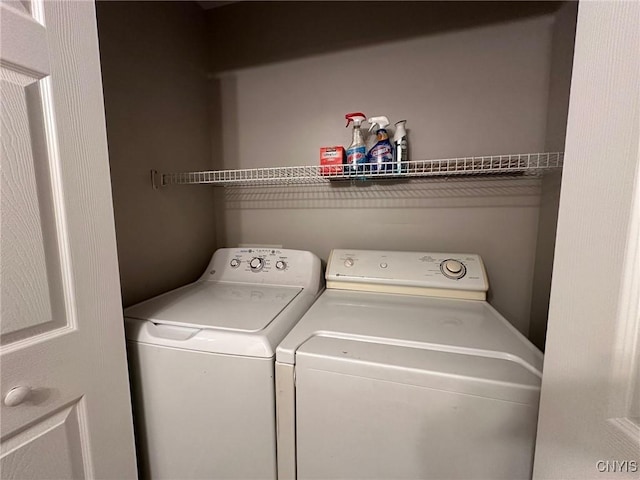 laundry room with washing machine and dryer