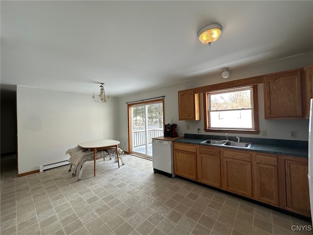 kitchen featuring white appliances, a chandelier, decorative light fixtures, baseboard heating, and sink