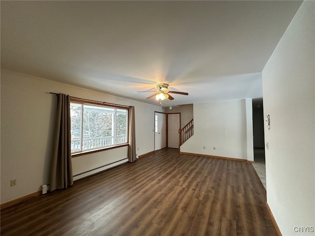 spare room featuring ceiling fan, a baseboard radiator, and dark hardwood / wood-style floors