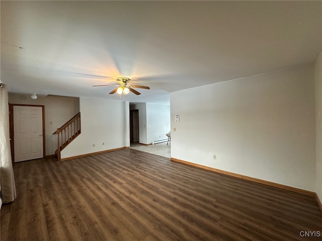 unfurnished living room with ceiling fan, dark wood-type flooring, and baseboard heating