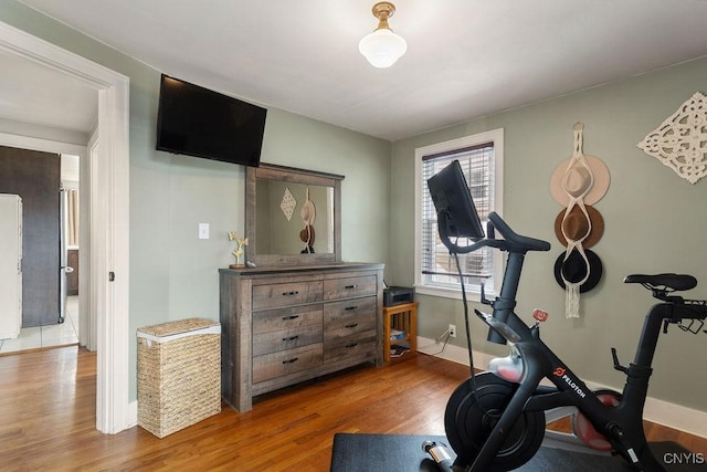 workout area featuring hardwood / wood-style flooring