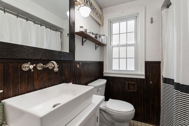 bathroom featuring toilet and vanity